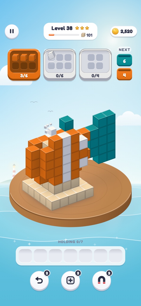 A clownfish sculpture with blocks flying into an orange crate